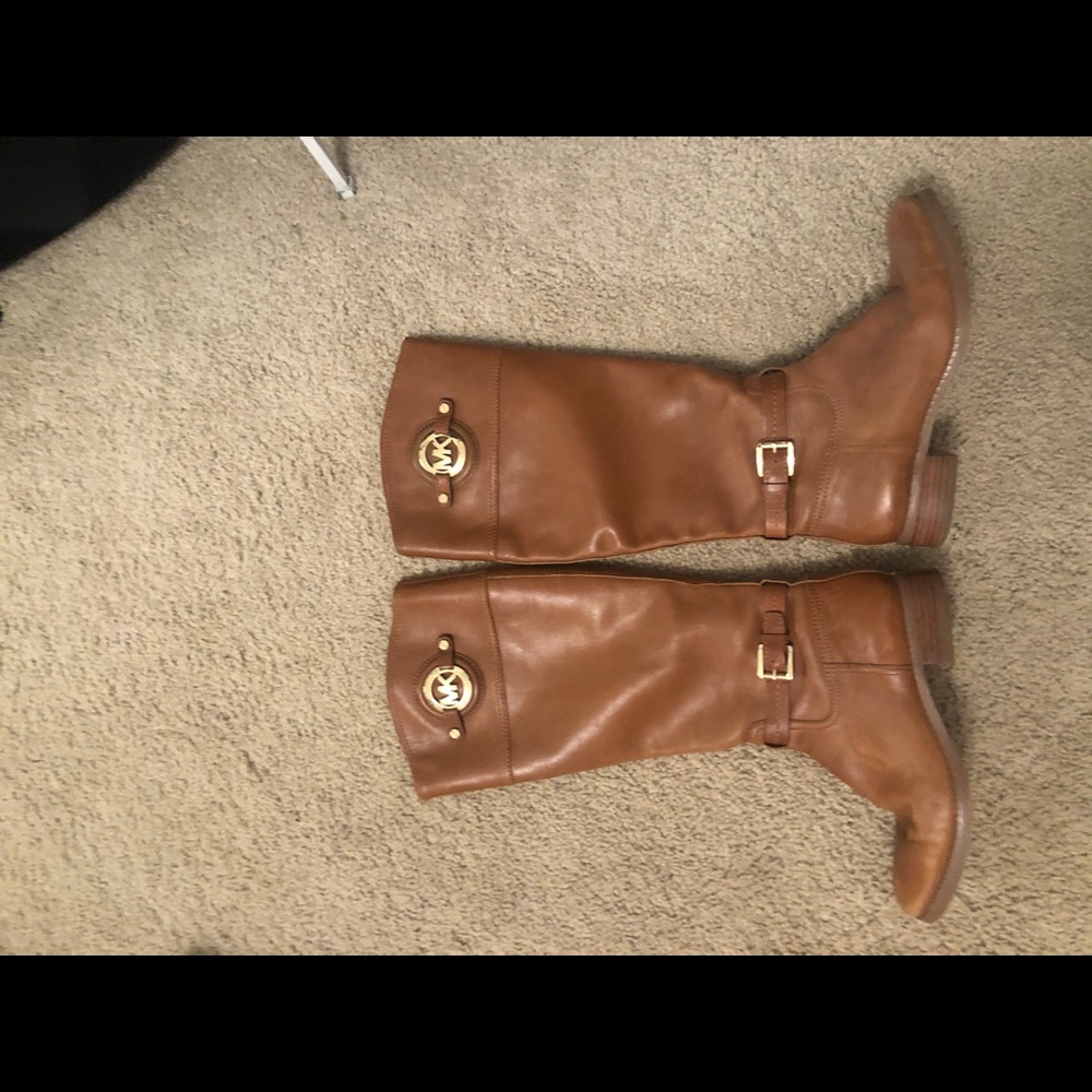 Women’s brown Michael Kors riding boots.